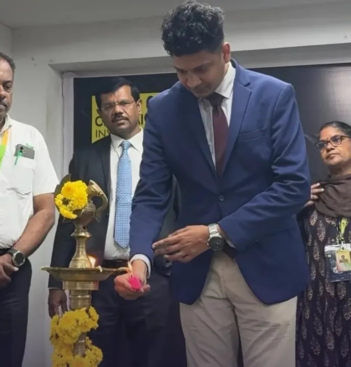 A Xakal speaker lights the ceremonial lamp at Chennai Institute of Technology