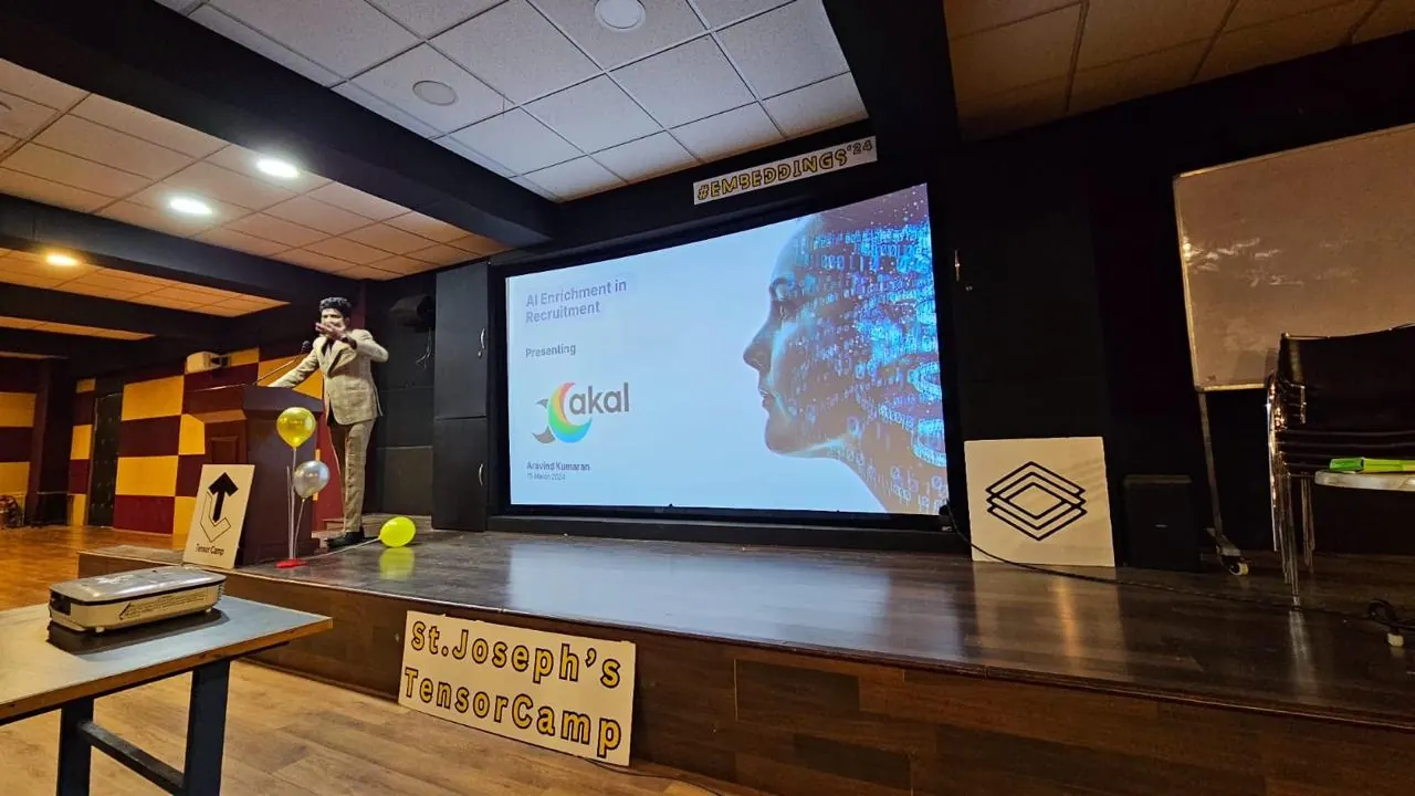 R. Aravind Kumaran presents AI Enrichment in Recruitment on stage at St. Joseph's TensorCamp